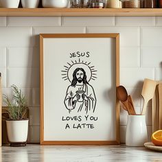 the jesus loves you a latte framed in a kitchen with oranges and utensils