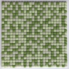 a green and white mosaic tile pattern on the wall in a bathroom or dining room