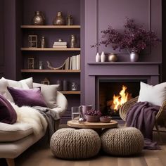 a living room filled with furniture and a fire place in the middle of the room