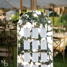 an outdoor wedding reception set up with seating cards