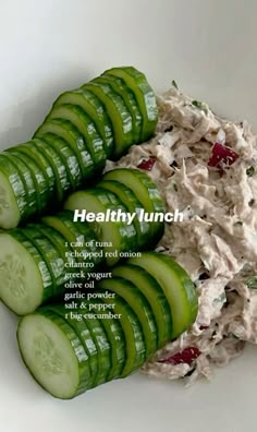 cucumber slices are arranged in the shape of a bowl with tuna salad on top