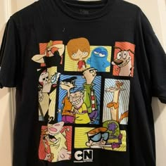 a black t - shirt with cartoon characters on it