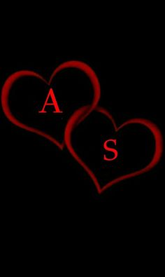 two red hearts with the letter s on them