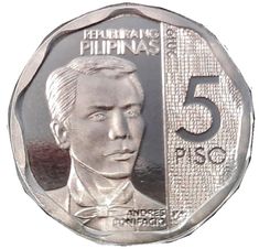 a silver coin with a man's face on the front and back of it