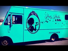 an ice cream truck is painted in blue and has a silhouette of a woman on the side