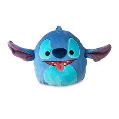 a blue stuffed animal with an open mouth