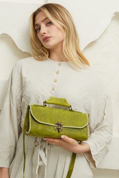 This green leather crossbody bag for women is made of genuine leather. It has a top handle and a long adjustable shoulder strap for carrying. The combination of smooth, supple leather and the rounded shape creates a dynamic and stylish design. Would make a wonderful graduation, anniversary, or birthday gift for your mother, girlfriend, or daughter. Handbag Design, Leather Crossbody Bags, Crossbody Bags For Women