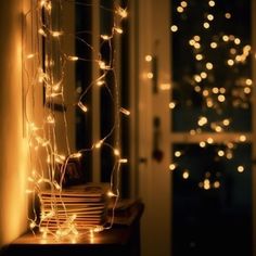 some lights that are on the side of a window sill in front of a door