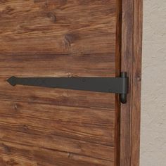 a wooden door with a metal handle on it