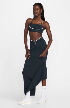 A signature Swoosh-shaped zipper pull is reinterpreted to resemble a J at the waist of this figure-skimming maxi skirt, highlighting Nike's collaboration with French fashion house Jacquemus. Hidden front-zip closure Stretch lining 90% polyeter, 10% spandex Machine wash, dry flat Imported Nordstrom x Nike: A curated lifestyle destination where fashion is the ultimate sport Nike Jacquemus, Nike X Jacquemus, Sport Skirt, Sports Skirt, Long Skirts For Women, Sports Skirts, French Fashion, Long Skirt, Givenchy