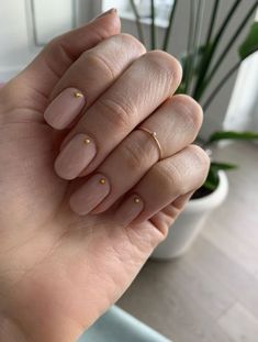 Discover the must-try nail trends of 2024 with our guide to short, neutral summer nails. From timeless taupe to delicate floral art, find the perfect design to match your summer vibe. Get inspired with our curated selection of chic and minimalist ideas that promise to elevate your style this season. Gold Studded Nails, Minimal Gold Nail Art, Dots Nails Minimalist, Gold Minimal Nails, Gold Dot Nail Art, 3 Dot Nails, Gold Stud Nails, Minimalist Dot Nails, Studded Nail Art