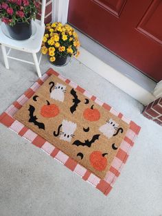 a door mat with halloween decorations on it