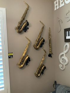 Wallmounted stands with saxophones in a home setting to keep the instruments safe, ready to play, but away from kids, pets, vacuum cleaners and other hazards! Saxophone Stand, Wall Stand, Saxophones, Cant Touch This, Soprano Saxophone, Alto Sax, Tenor Saxophone, Music Centers, Music Aesthetic