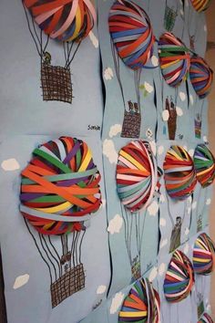 colorful hot air balloons are hanging on the wall