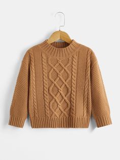 a brown sweater hanging on a hanger with an image of a cable knit sweater