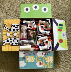 an open box with toothbrushes and toothpaste in it