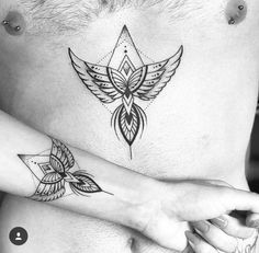 a woman's chest with two tattoos on her left side and an arrow tattoo on the right side