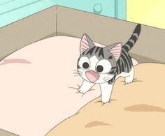 a cartoon cat standing on top of a bed next to a pillow with its mouth open