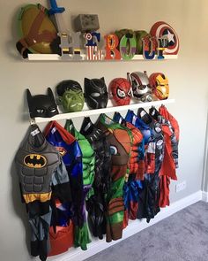 there are many costumes hanging on the wall next to each other in this boys'room