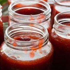 several jars filled with liquid sitting on top of a table