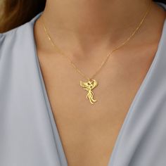 Discover the elegance of our 14K gold plated phoenix necklace, a stunning piece that symbolizes rebirth and strength. This high-quality jewelry makes a perfect gift for women on any special occasion. 🌟 Elegant Design: The intricate phoenix design is beautifully detailed and crafted to perfection. ✨ High-Quality Material: Made with 14K gold plating for a luxurious look and long-lasting wear. 🎁 Perfect Gift: Ideal for birthdays, anniversaries, graduations, or just to show someone special you car Phoenix Jewelry, Phoenix Necklace, Phoenix Design, Minimalist Pendant, Jewelry Minimalist, Neck Piece, High Quality Jewelry, Gift For Women, Quality Jewelry