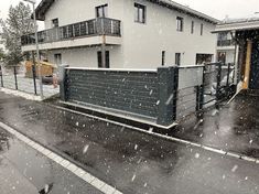 a house is shown with snow falling on the ground