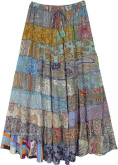 A beautiful multi-panel long skirt in multiple color tone variations ins oft silk satin fabric and good fall. The skirt has an elastic waist with a tassel drawstring. #tlb #Patchwork #MaxiSkirt #Printed #TieredSkirt #SilkSkirt Turquoise Blue Color, Hippie Skirts, Silk Satin Fabric, Garment Industry, Patchwork Skirt, Hippie Look, Fairy Clothes, Trendy Skirts, Long Maxi Skirts