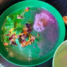 two bowls filled with different colored powdered items