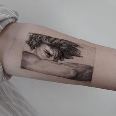 a woman's arm with a drawing on it