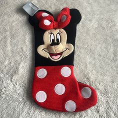 a minnie mouse stocking is laying on the floor