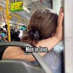 a person sitting on a bus with their head in the back of it's seat