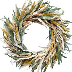 a wreath made out of dried flowers and leaves