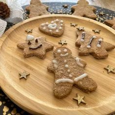 some cookies are arranged on a wooden plate