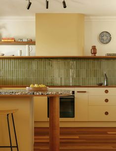 a kitchen with an island and counter tops