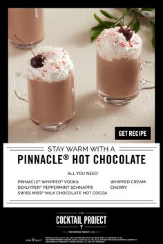 two hot chocolate drinks with whipped cream and cherries