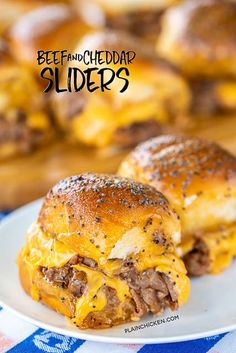 two cheeseburger sliders on a plate with blue and white checkered table cloth