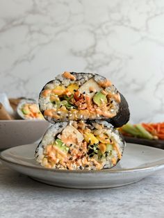 two sushi rolls stacked on top of each other