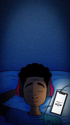 a person laying in bed with headphones on