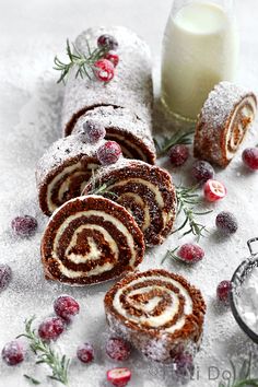 some food that is laying out on the ground with cranberries and powdered sugar