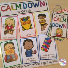 the calm down posters are displayed on a table