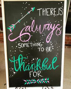 there is a chalkboard sign that says there is always something to be grateful for