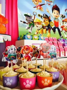 paw patrol cupcakes are displayed on a table