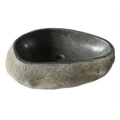 a stone sink with a black bowl in it on a white background for use as a decoration