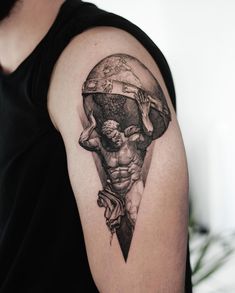 a man's arm with a tattoo on it and an image of the earth