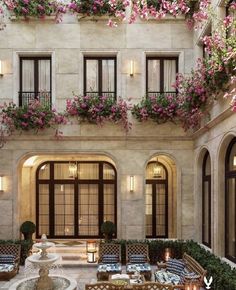 an elegant courtyard with potted plants and flowers