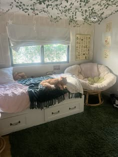 a dog laying on top of a bed in a room with green carpeted flooring