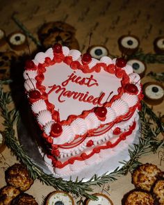 a heart shaped cake sitting on top of a table