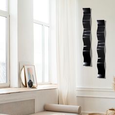 a living room filled with furniture next to a window