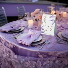 the table is set with place cards and silverware for guests to sit down at