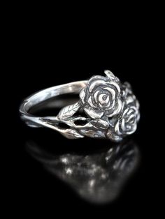 This beautiful and detailed Rose Ring is cast in solid sterling silver.  Two roses entwine and the leaves form the band of the ring. Indulge yourself or someone special in this sparkling bouquet.We have many ring sizes immediately available. We will contact you to let you know if we have your chosen ring size in stock or when to expect shipment.All Marty Magic Jewelry is packaged in a beautiful box embossed with the gold foil Marty Magic dragon logo. Perfect for any occasion.Designed in Californ Rose Jewelry Flower, Silver Rose Ring, Silver Flower Ring, Silver Gold Jewelry, Jewelry Flower, Floral Jewelry, Jewelry Design Earrings, Rose Ring, Rose Jewelry